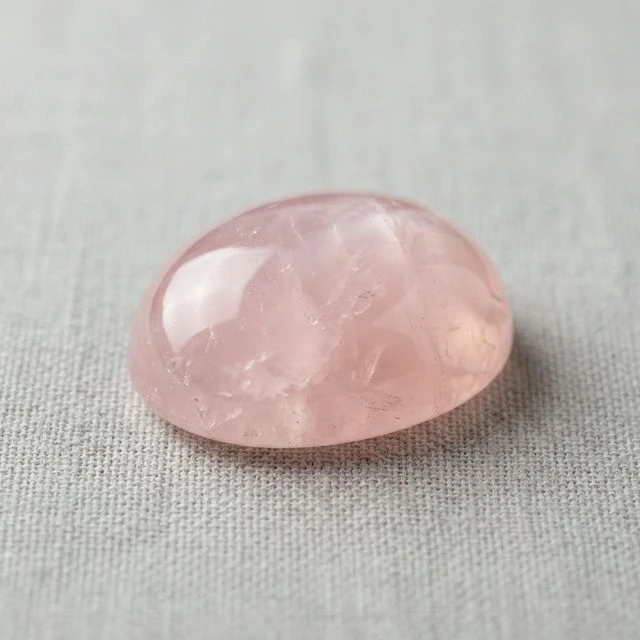 Polished rose quartz showing smooth surface and vitreous luster